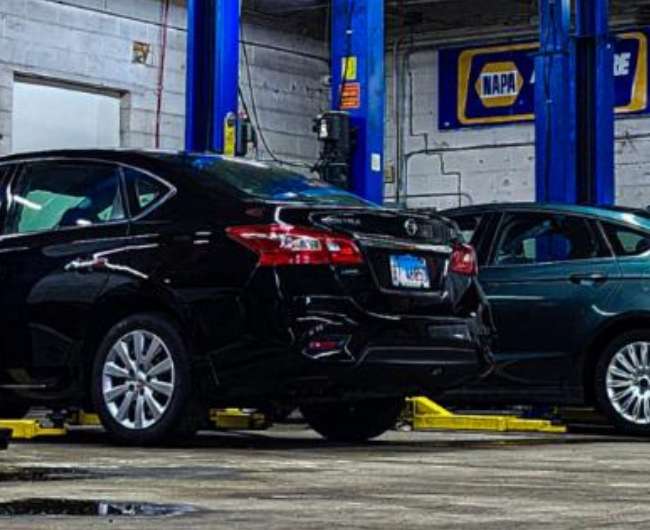 Technician performing vehicle diagnostics in Chicago
