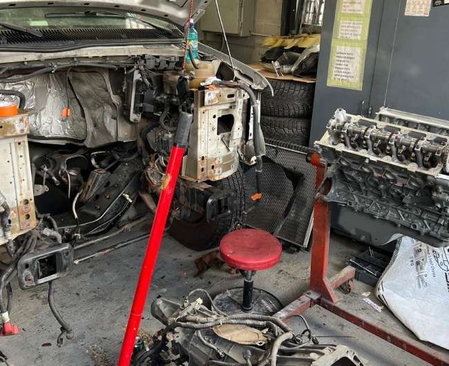 Mechanic performing mechanical repair on a vehicle in Chicago